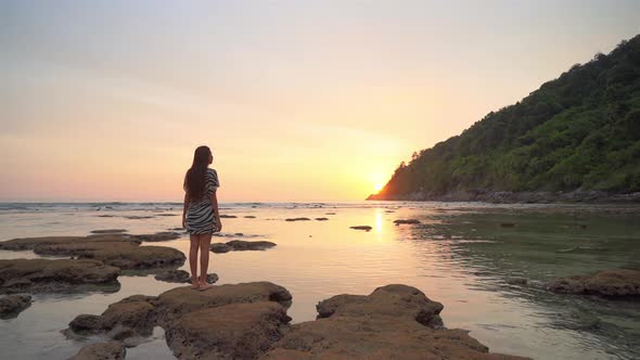 Asian woman enjoy around beautiful beach sea ocean