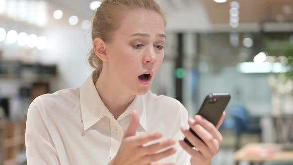 Portrait of Young Businesswoman Having Loss on Smartphone 