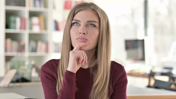 Portrait of Beautiful Young Woman Thinking New Idea 