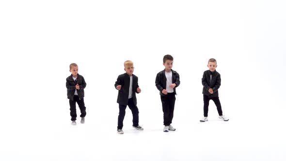 Kids Are Dancing a Modern Dance on the White Background in Black Leather Jackets and Jeans. Slow
