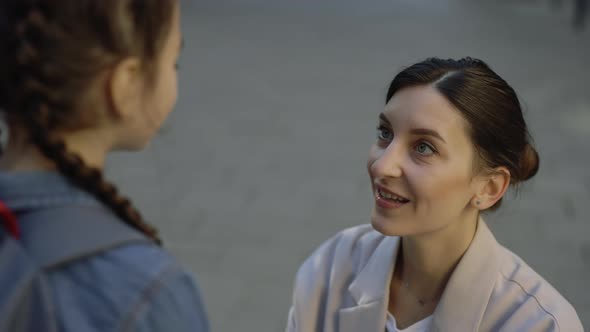 Communication Between Mother and Child Before School on the Street