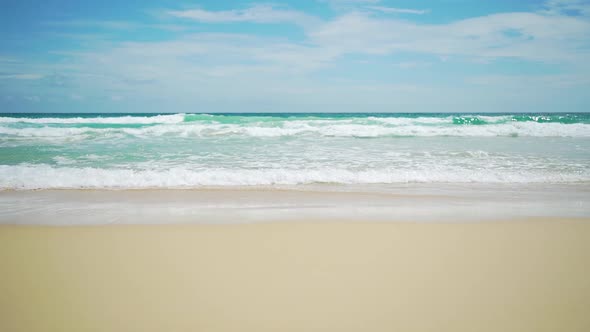 Sea splashes water wave runs on the sandy .