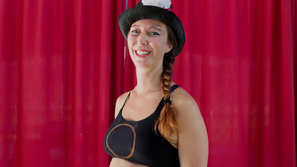 Portrait of happy circus artist with hat