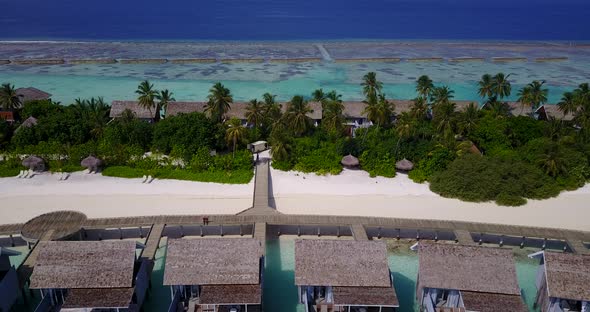 Tropical above abstract view of a white sandy paradise beach and blue sea background in high resolut