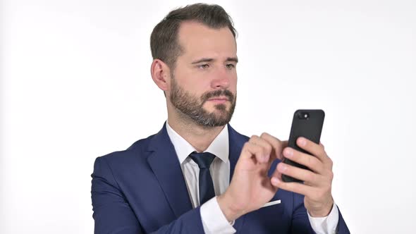 Cheerful Businessman Using Smartphone, White Background