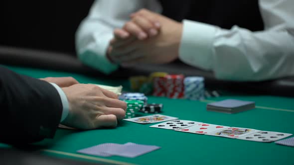 Confident Businessman Playing Poker Betting All Property in Risky Game, Gambling