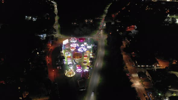 Aerial Hyperlapse of a Travelling Fairground in a Town