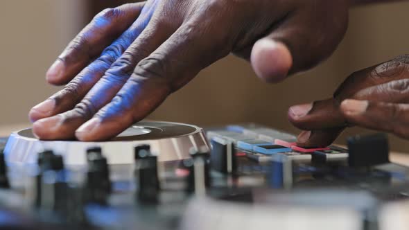 Closeup Unrecognizable DJ Man African Skin Male Hands Playing Live Electronic Music on Party in Club