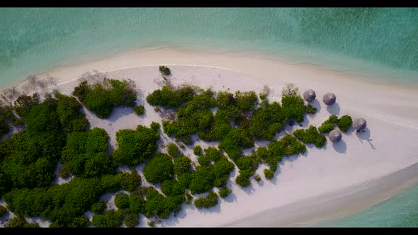 Aerial drone shot landscape of idyllic lagoon beach voyage by blue lagoon and white sandy background