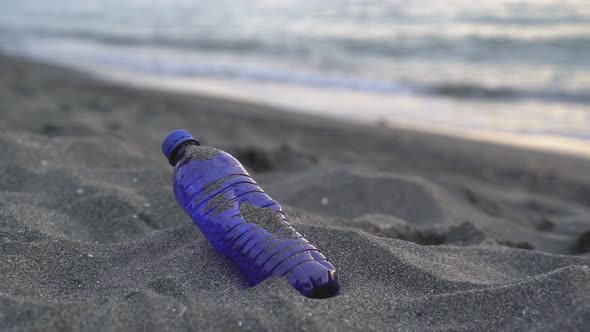 Unrecognizable Volunteer Cleaning Shore From Plastic