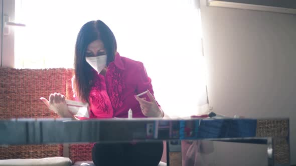 Woman Holding a Rapid Serological Testing Kits for COVID19 Pandemic Enjoying Result