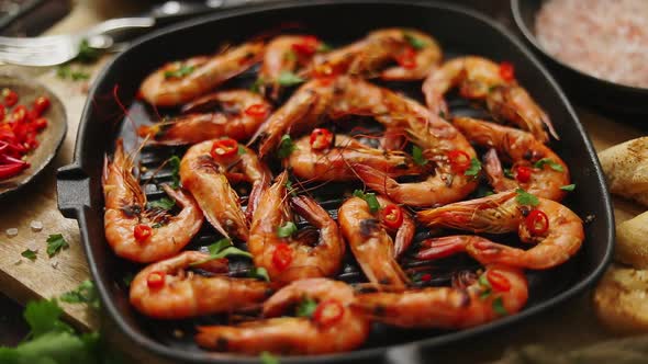 Grilled Shrimps in Cast Iron Grilling Pan with Fresh Lemon, Parsley, Chili, Garlic White Wine Sauce