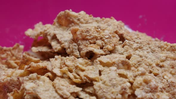 Background of healthy dried cereals and rice flakes in the bowl 4K 2160p 30fps UltraHD tilting foota
