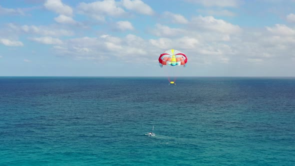 Parasailing in Cancun's turquoise waters