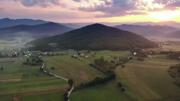 Evening landscape with the sunset and beautiful mountains