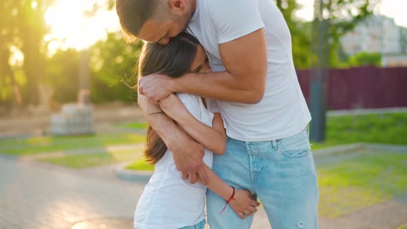 Father Hugs Daughter