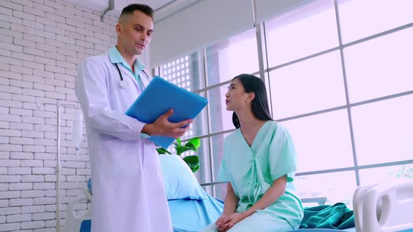 Doctor in Professional Uniform Examining Patient at Hospital