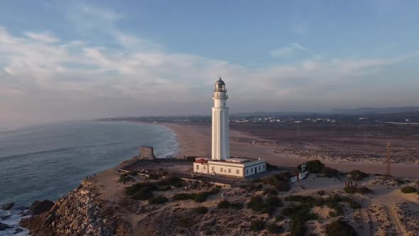 Lighthouse on cape near sea
