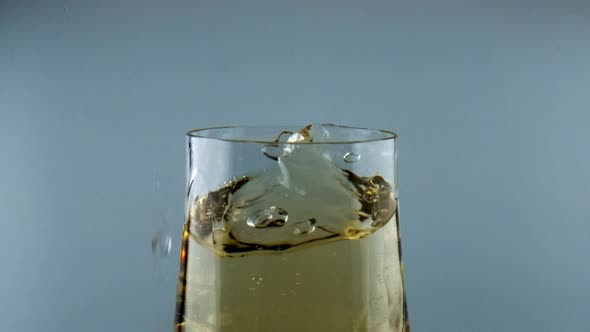 Ice Cube Falling Wine Goblet Closeup