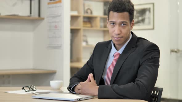 Thumbs Up By African Businessman at Work