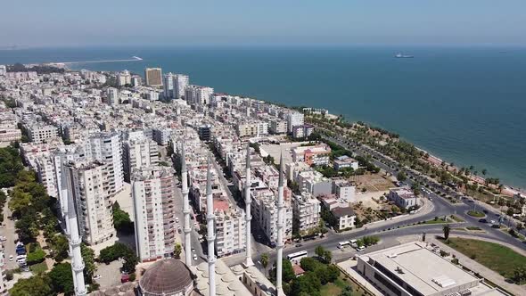 Aerial view of mosque with six minarets and panorama of seaside city. Mersin, Turkey