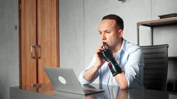 Serious cyborg man programmer with artificial limb prothesis