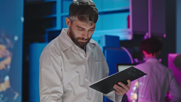 Male Scientist Counting Samples alt