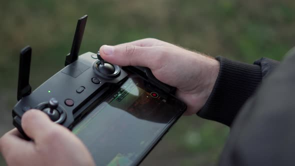 Man Controls Drony Console, Close-up