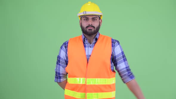 Happy Young Overweight Bearded Indian Man Construction Worker with Ok Sign