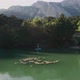 SUP Surfer Rows on Small Lake in Mountains - VideoHive Item for Sale