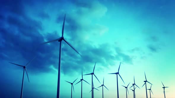 Electricity generating wind turbines spinning around. Loopable animation. HD