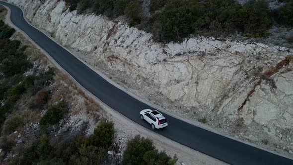 Car Travel Concept Aerial View of Mountain Road Near Sea at Lefkada Island