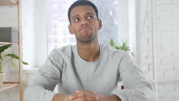 Portrait of AfroAmerican Man Shaking Head to Accept Yes Indoor