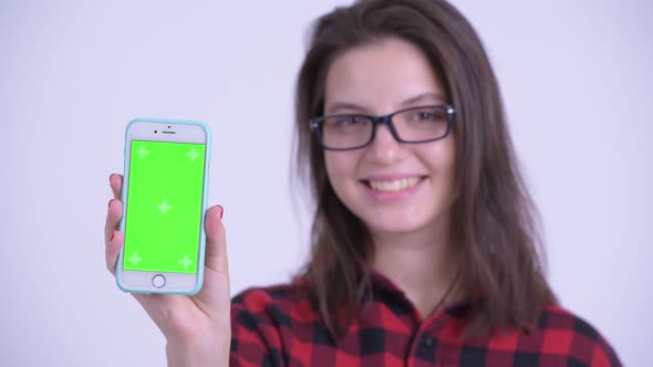 Face of Happy Young Beautiful Hipster Woman Showing Phone