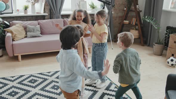 Happy Kids Playing Game at Home