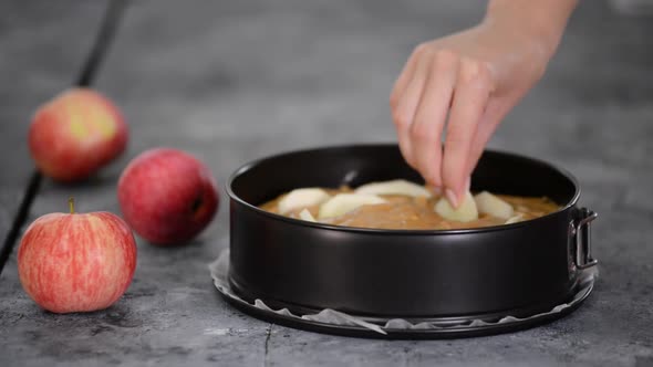 Woman Preparing Delicious Apple Cake at Home