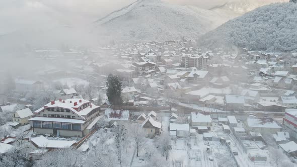 Krasnaya Polyana Village Surrounded By Mountains Covered with Snow