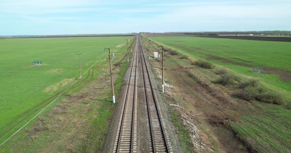 Empty Railroad Tracks Stretching Into the Distance