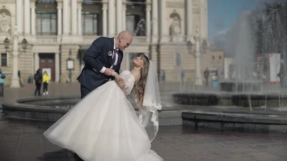 Newlyweds in the Center of the Old Town. Kiss. Bride and Groom. Wedding