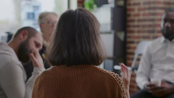 Close Up of Woman Sharing Addiction Story to People in Circle at Aa Group Meeting