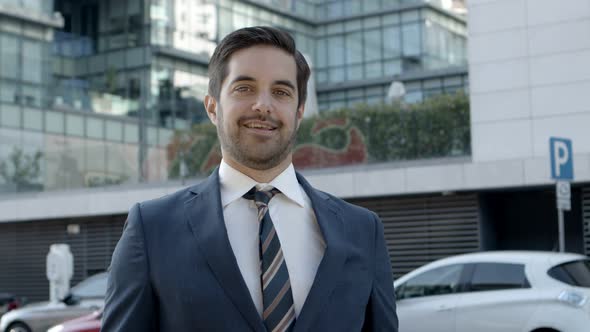 Professional Young Businessman Smiling at Camera