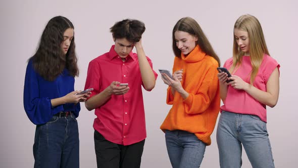 A Group of Handsome Young People are Texting with a Mobile Phone