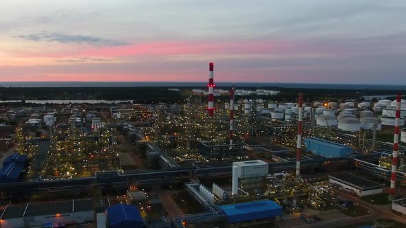 Aerial view of the petrochemical oil refinery plant shines at night