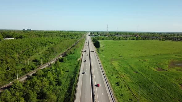 Aerial View of Cars and Truck Drive Along the Highway