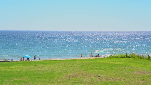 Grassy Field Near a Pleasant Looking Beach and Glistering Ocean Water in Vale Do Lobo Portugal