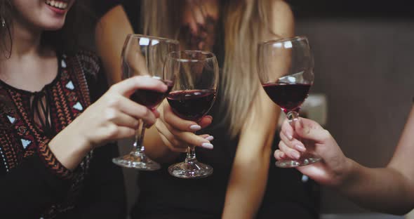 Celebrating Time Three Women Closeup Drinking Red