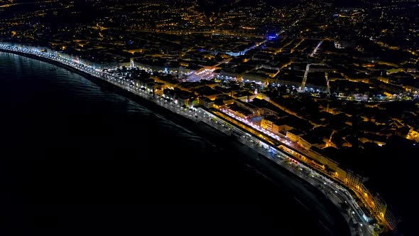 Aerial Hyperlapse of Night Nice France Promenade, Mediterranean Sea View. Night City Aerial View