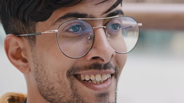 Male Portrait Closeup Young Bearded Indian Guy with Glasses Looks Away Happy Smiling Man Waiting for