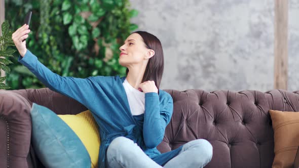 Adorable Happy Young Woman Having Positive Emotions Posing Taking Selfie