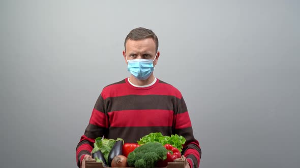 A Male Volunteer Delivers Food and Vegetables To People in Quarantine